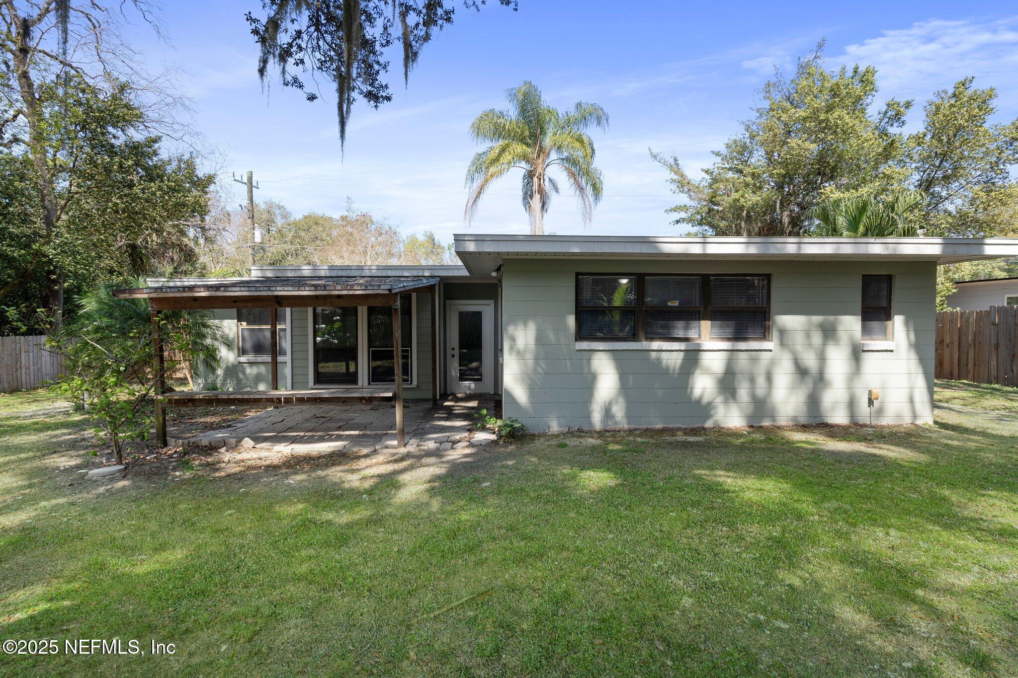 2838 Rainbow Road Jacksonville, FL 32217 - Photo 34 of 35 a view of a house with a yard and sitting area