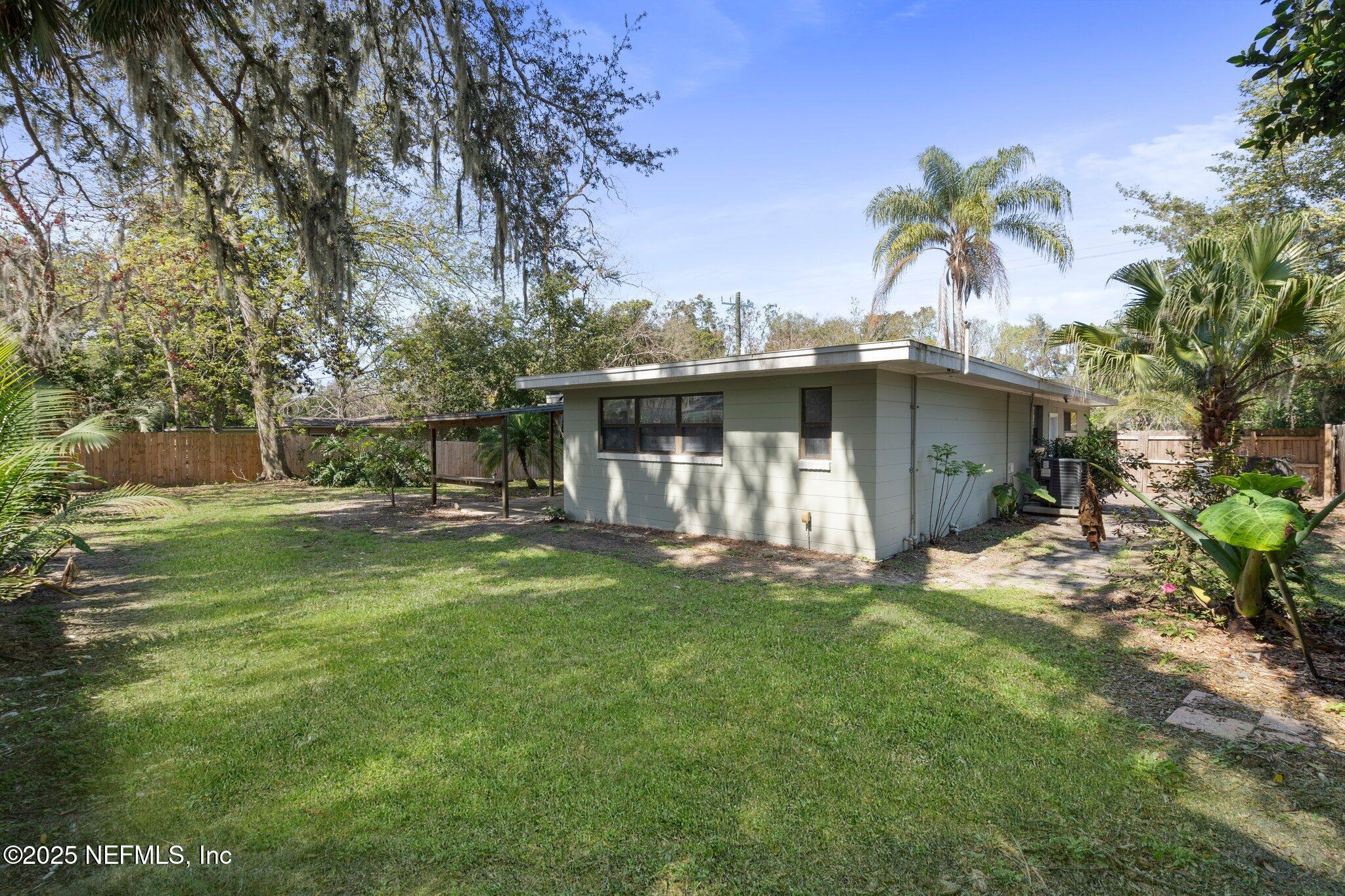 2838 Rainbow Road Jacksonville, FL 32217 - Photo 35 of 35 a view of a house with a yard and sitting area