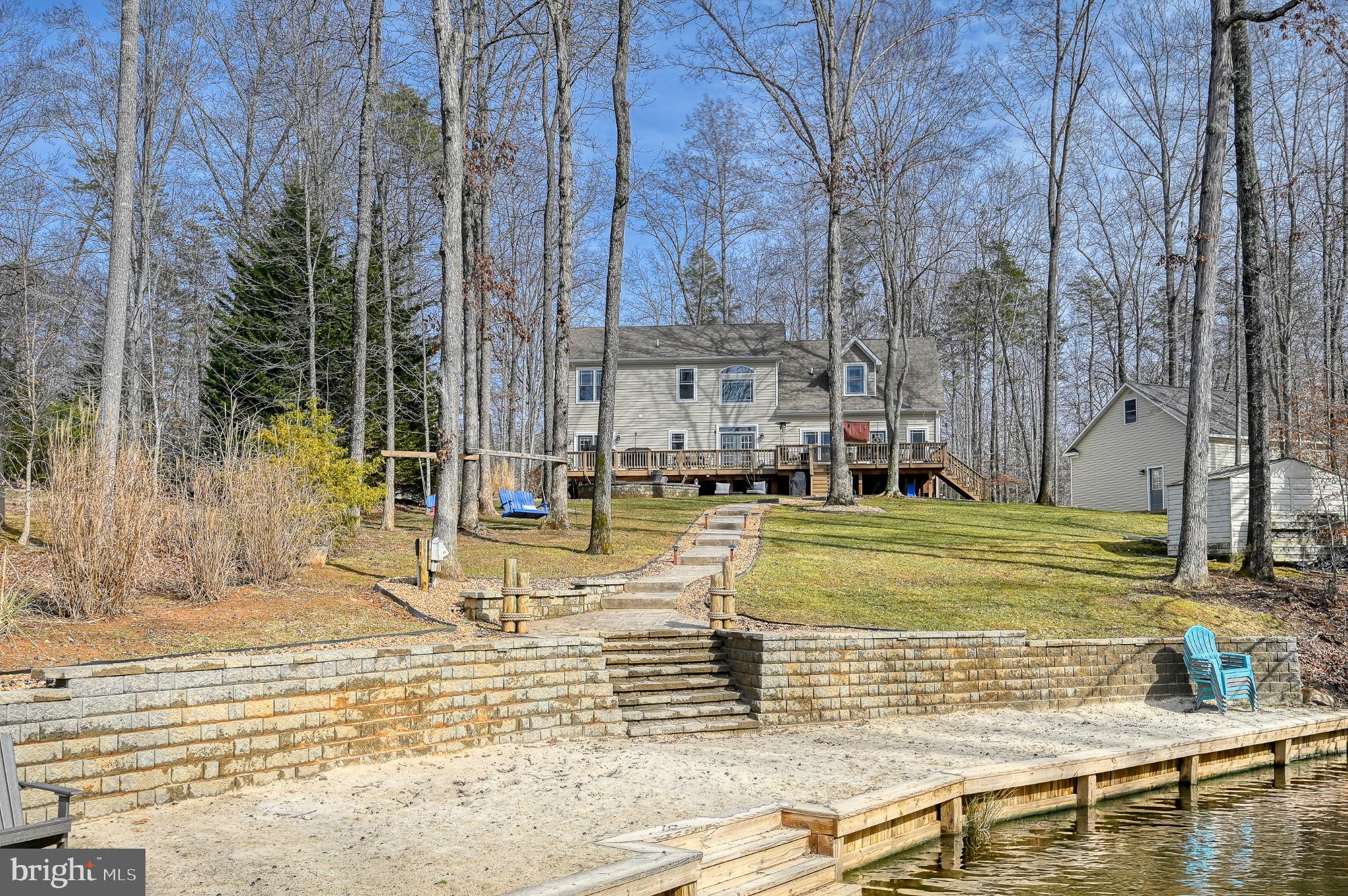 14 Elnor Road Bumpass, VA 23024 - Photo 12 of 69 a view of swimming pool with lawn chairs and plants