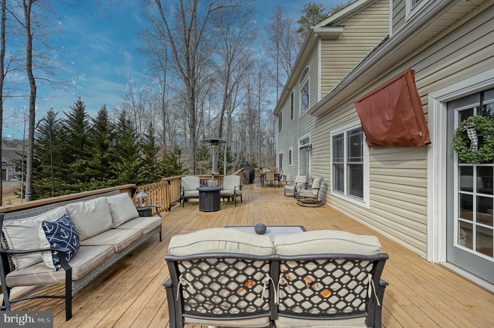 14 Elnor Road Bumpass, VA 23024 - Photo 14 of 69 a view of a patio with couches table and chairs and potted plants