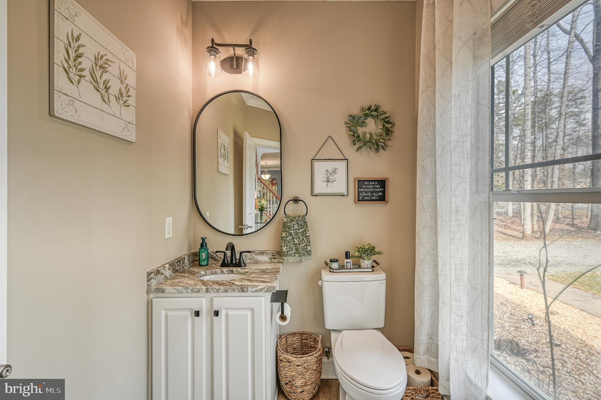 14 Elnor Road Bumpass, VA 23024 - Photo 20 of 69 a bathroom with a toilet a sink and a window