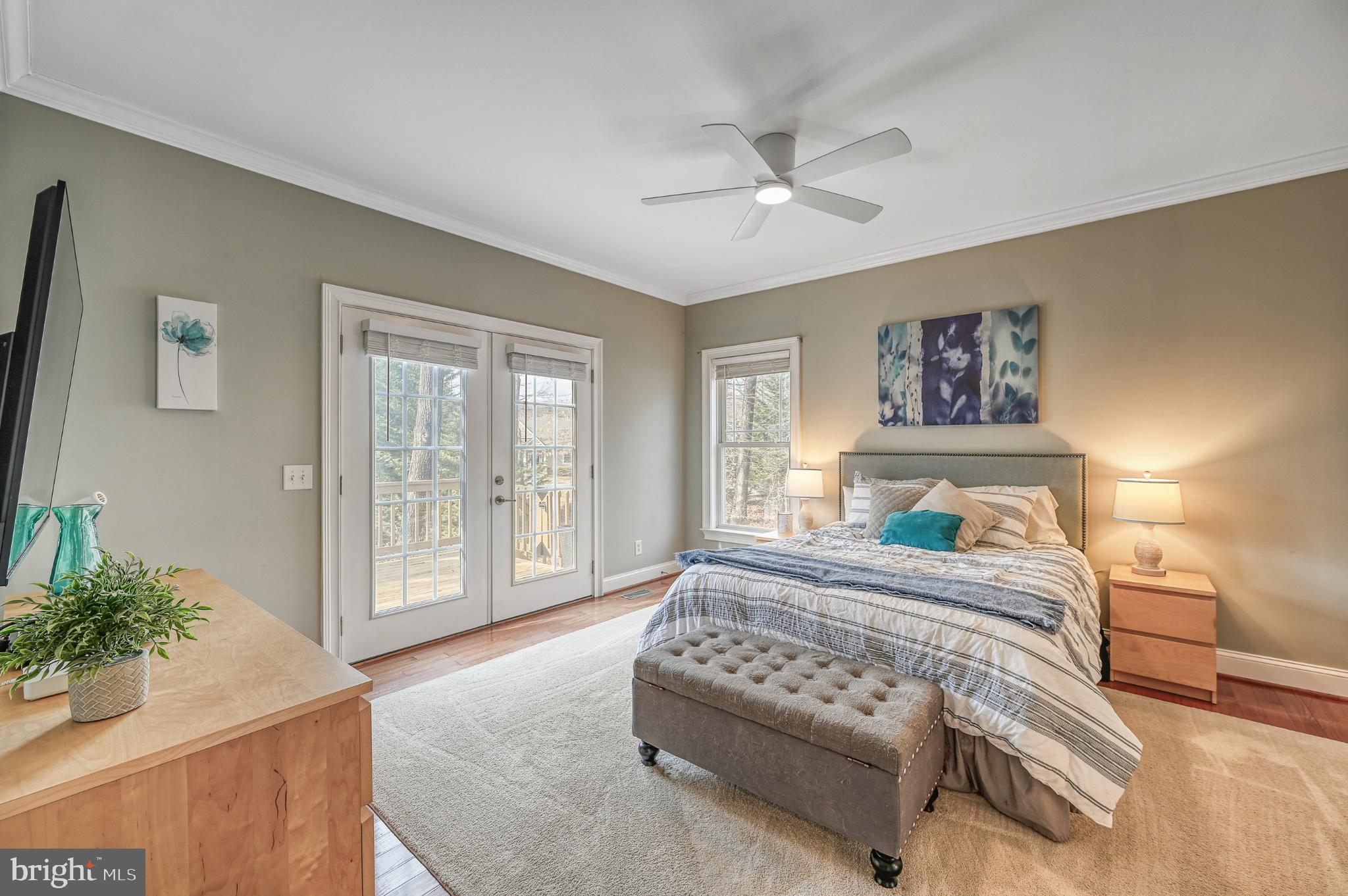 14 Elnor Road Bumpass, VA 23024 - Photo 21 of 69 a bedroom with a large bed and a chandelier