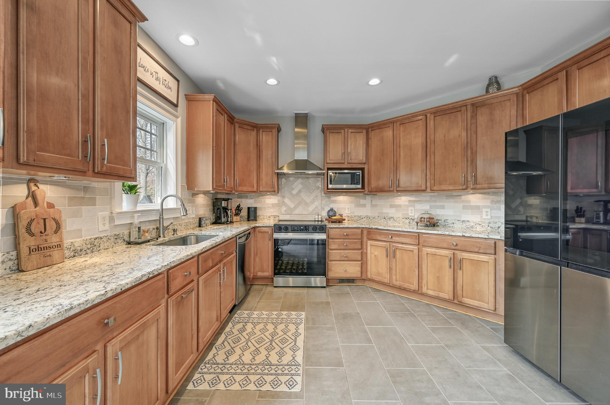 14 Elnor Road Bumpass, VA 23024 - Photo 27 of 69 a kitchen with stainless steel appliances granite countertop a stove sink and cabinets