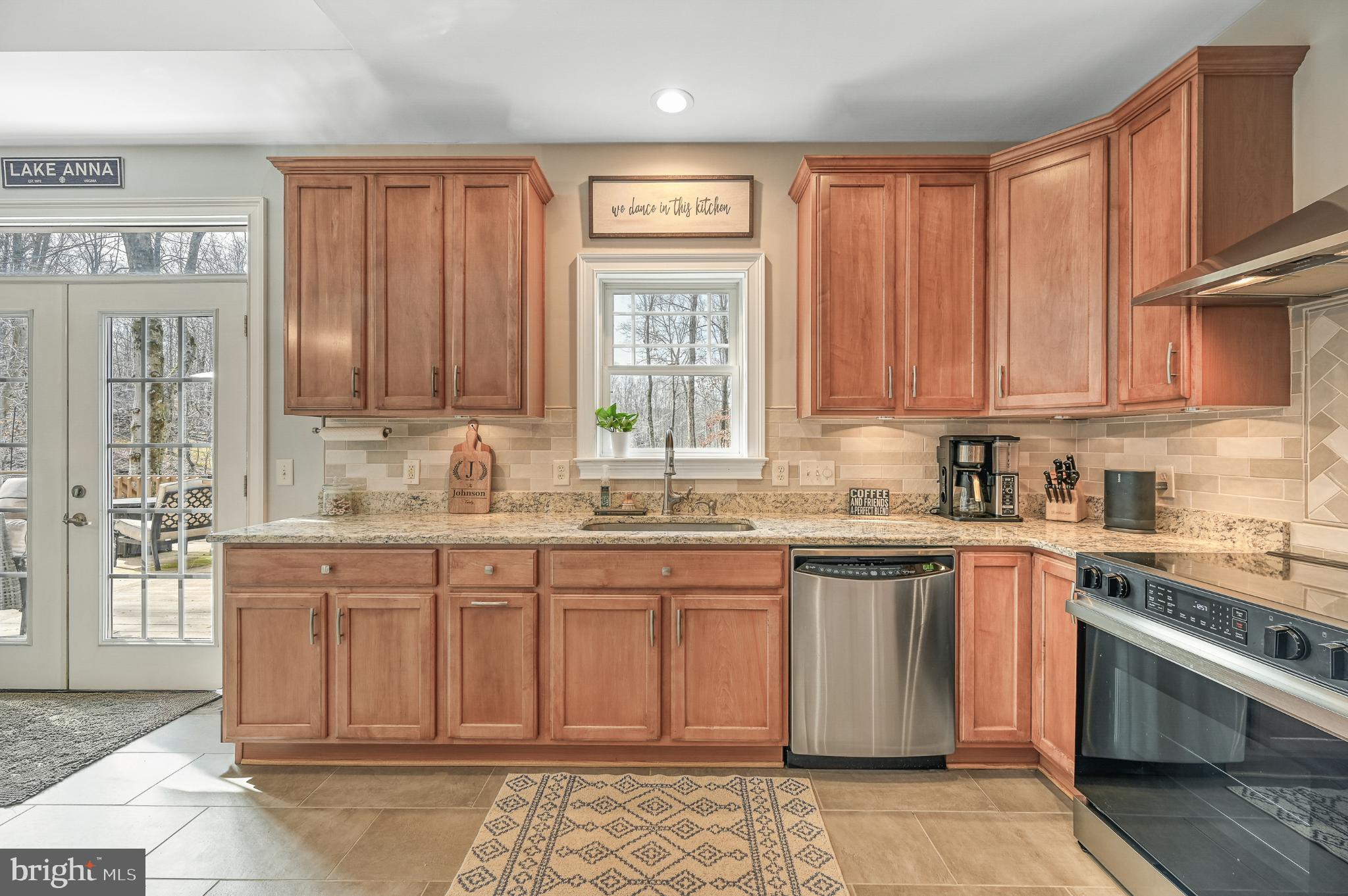 14 Elnor Road Bumpass, VA 23024 - Photo 28 of 69 a kitchen with stainless steel appliances granite countertop a stove a sink dishwasher and a refrigerator