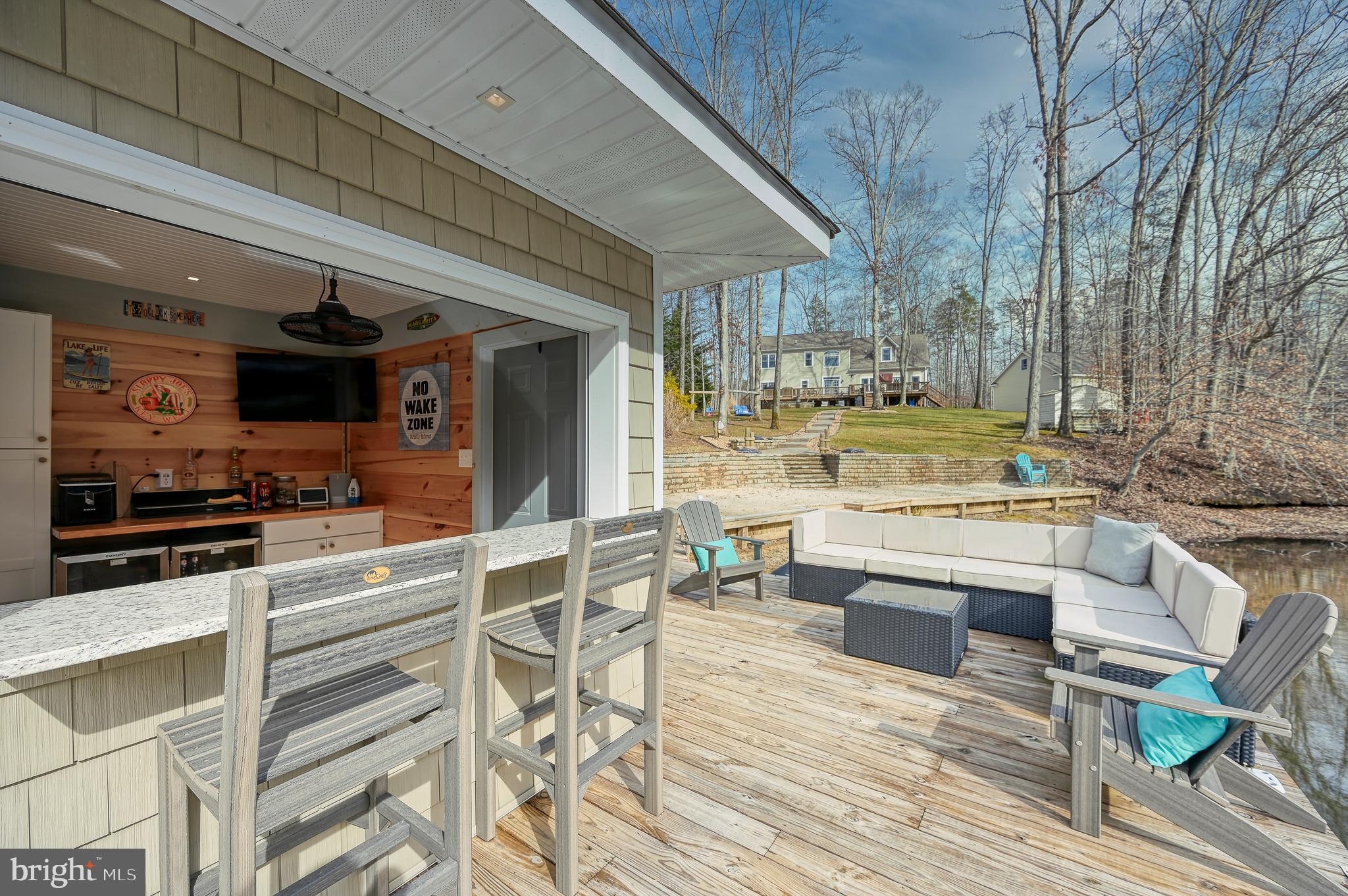 14 Elnor Road Bumpass, VA 23024 - Photo 4 of 69 a view of living room kitchen with stainless steel appliances wooden floor and table chairs