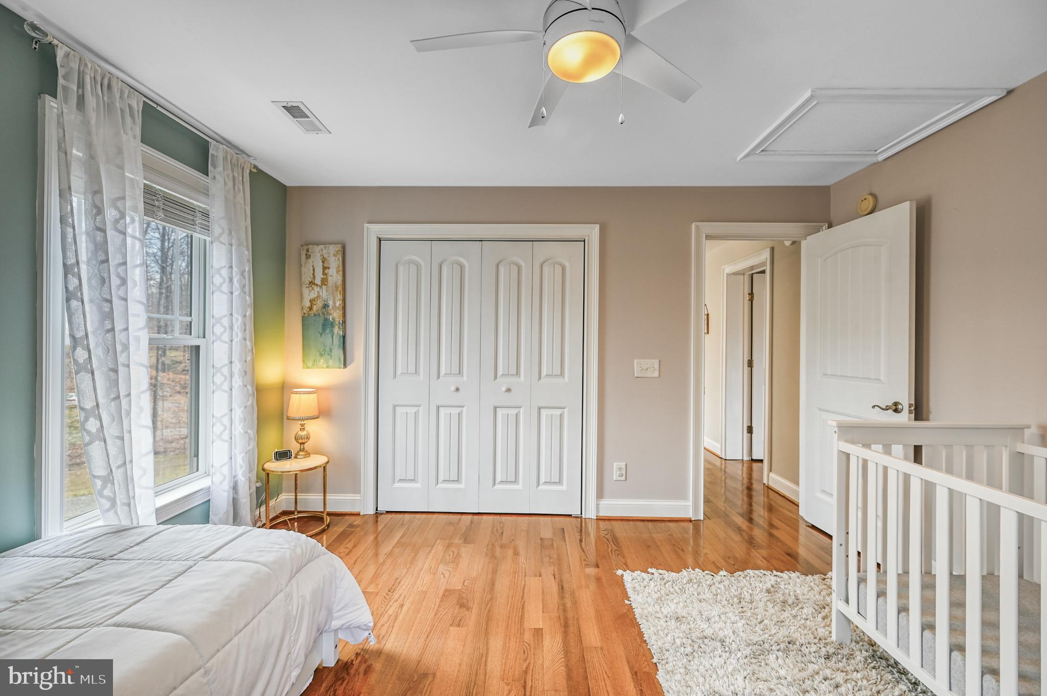 14 Elnor Road Bumpass, VA 23024 - Photo 43 of 69 a spacious bedroom with a bed and wooden floor