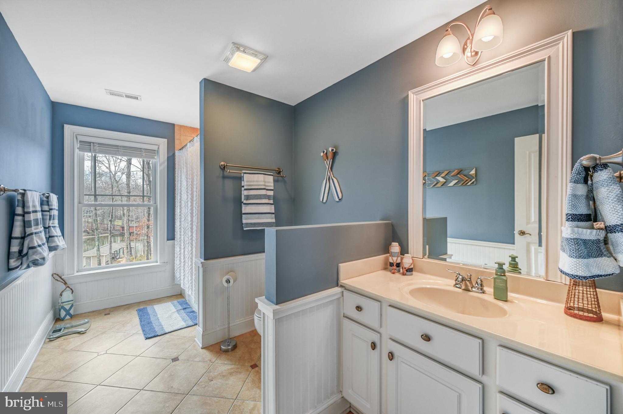 14 Elnor Road Bumpass, VA 23024 - Photo 45 of 69 Serene bathroom with calming blue hues.