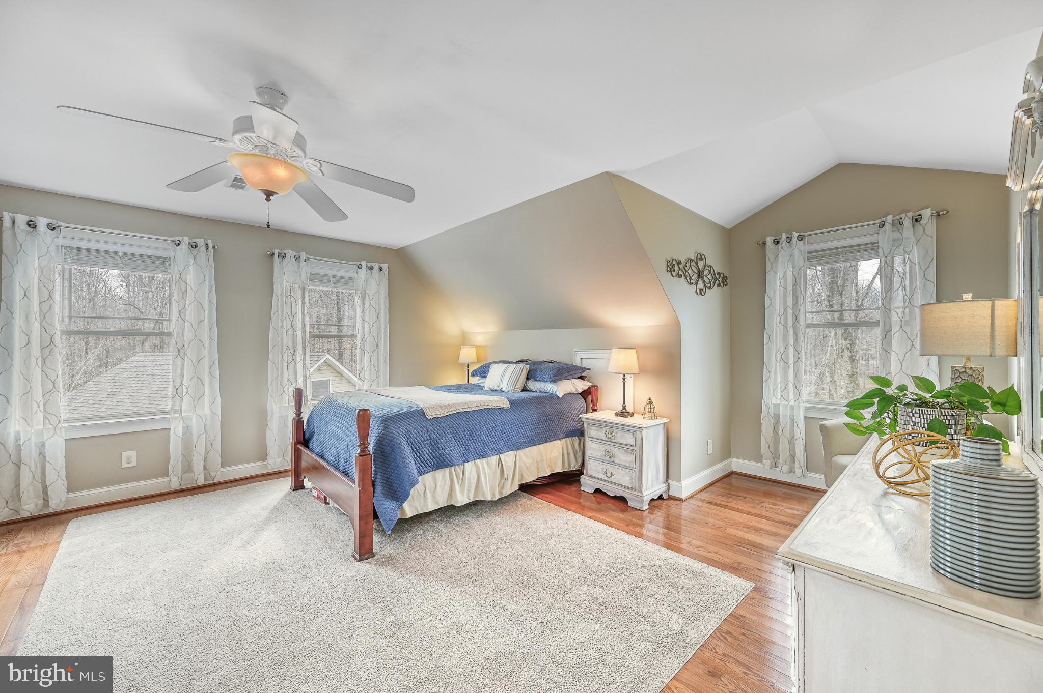 14 Elnor Road Bumpass, VA 23024 - Photo 47 of 69 a spacious bedroom with a bed and a chandelier