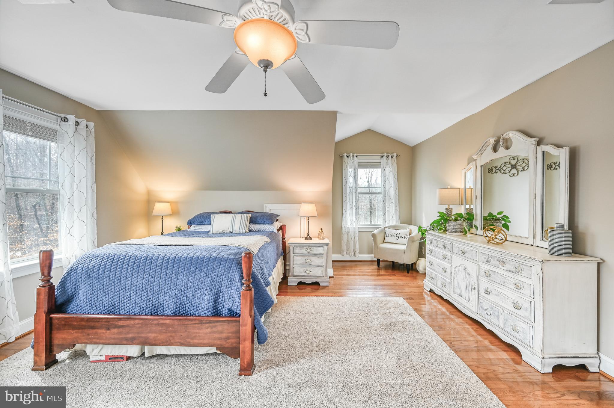 14 Elnor Road Bumpass, VA 23024 - Photo 48 of 69 a bedroom with a large bed and a chandelier