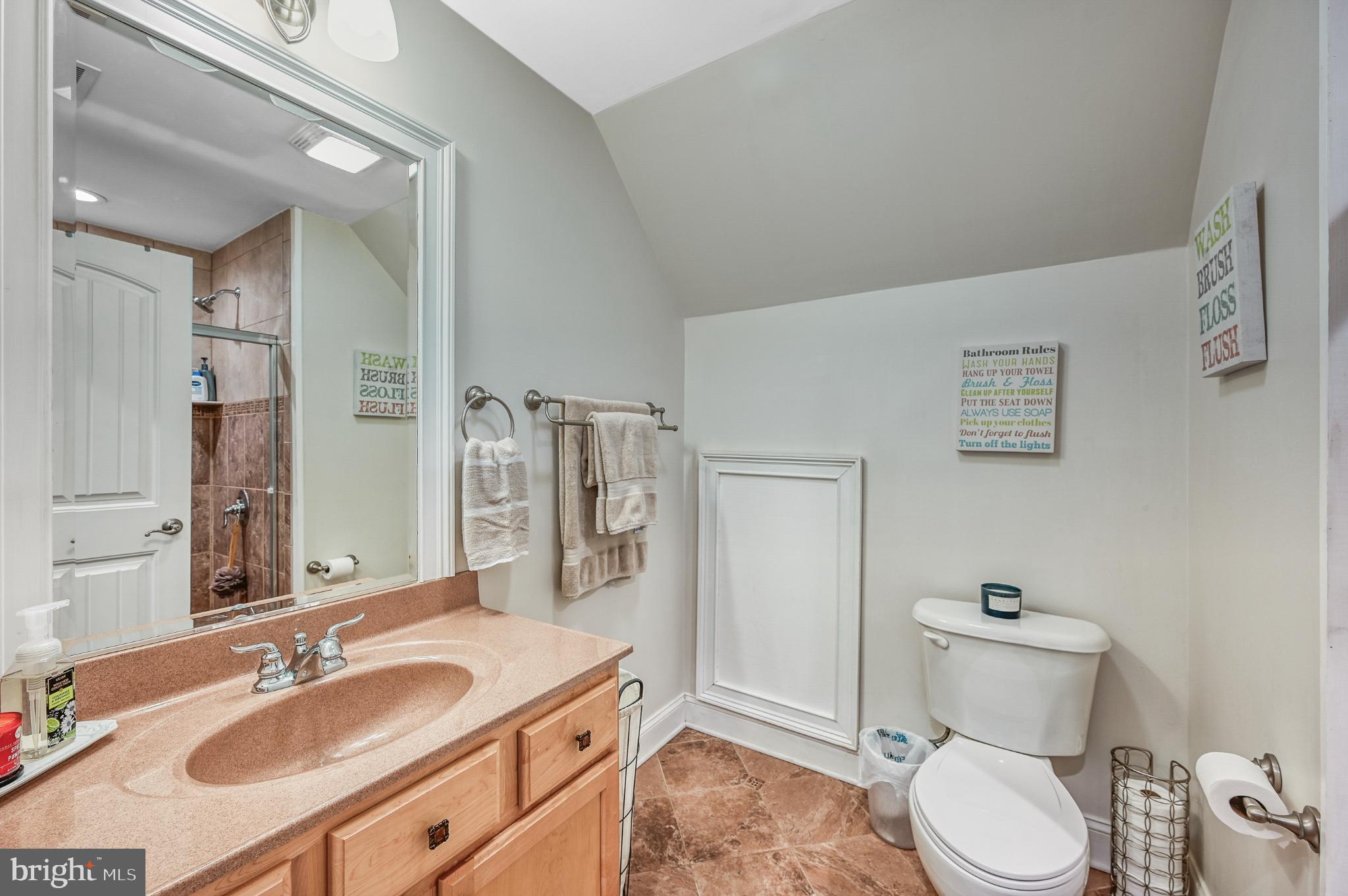 14 Elnor Road Bumpass, VA 23024 - Photo 50 of 69 a bathroom with a granite countertop toilet sink and mirror