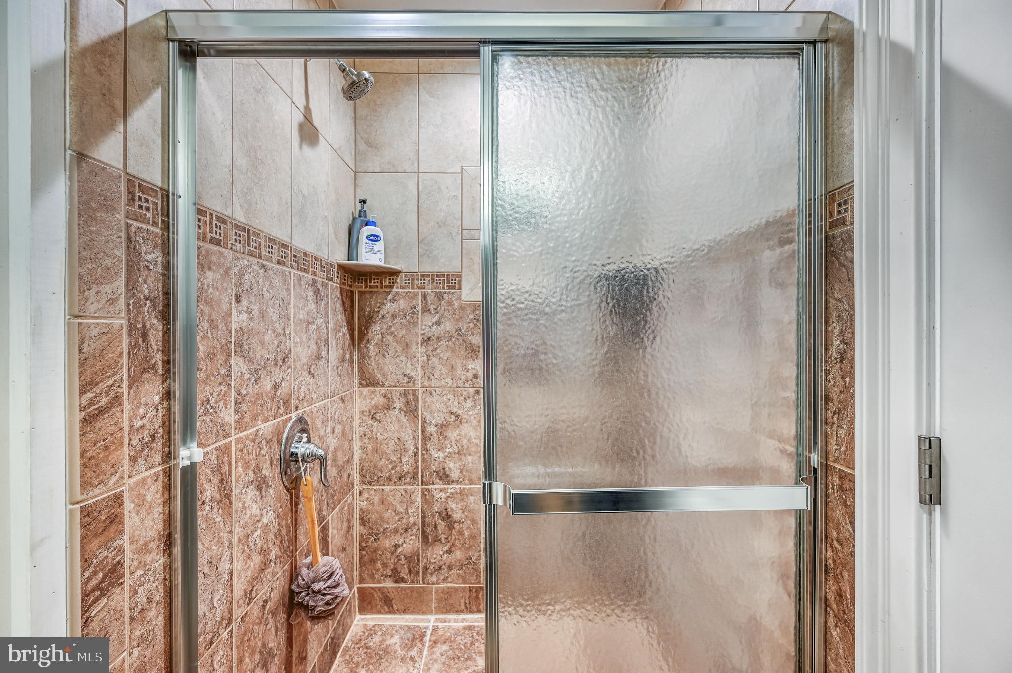 14 Elnor Road Bumpass, VA 23024 - Photo 51 of 69 a bathroom with a glass shower door