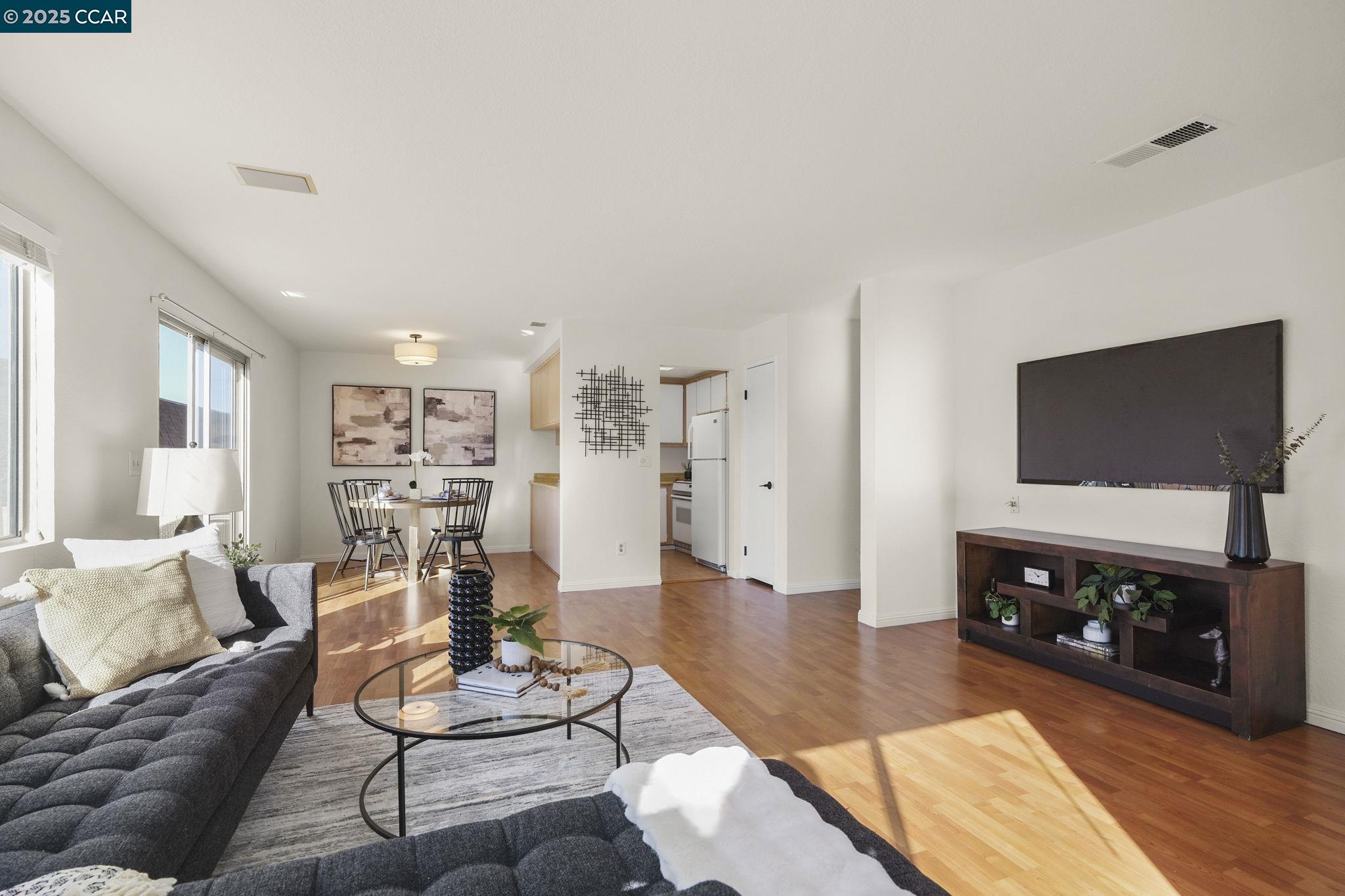 3641 Clayton Road, Unit 32 Concord, CA 94521 - Photo 1 of 1 a living room with furniture and a flat screen tv