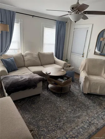 a living room with furniture and a window