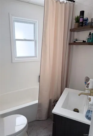 a bathroom with a sink and a bathtub