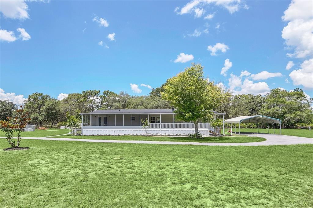 5901 Jack Brack Road St. Cloud, FL 34771 - Photo 1 of 1 a view of house with a big yard