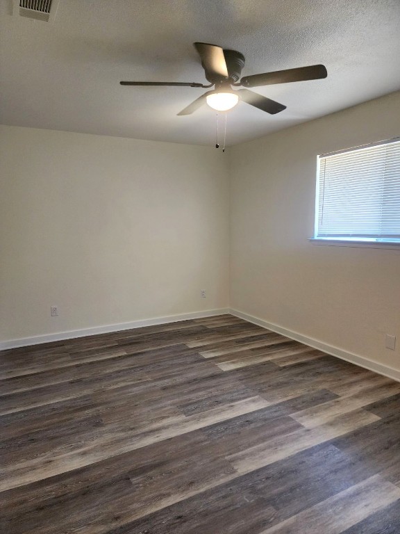 6905 Argonne Forest Cove, Unit B Austin, TX 78759 - Photo 11 of 18 a view of empty room with wooden floor