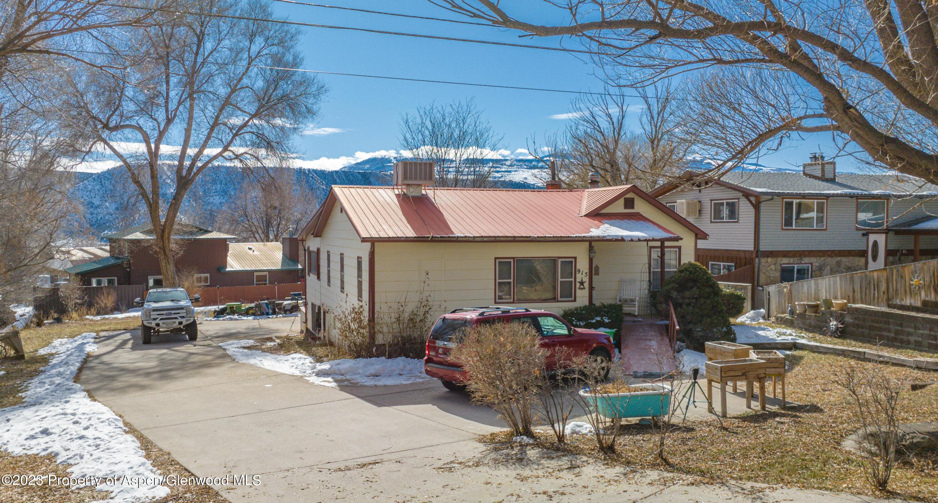 915 East 7th Street Rifle, CO 81650 - Photo 1 of 22 a front view of a house
