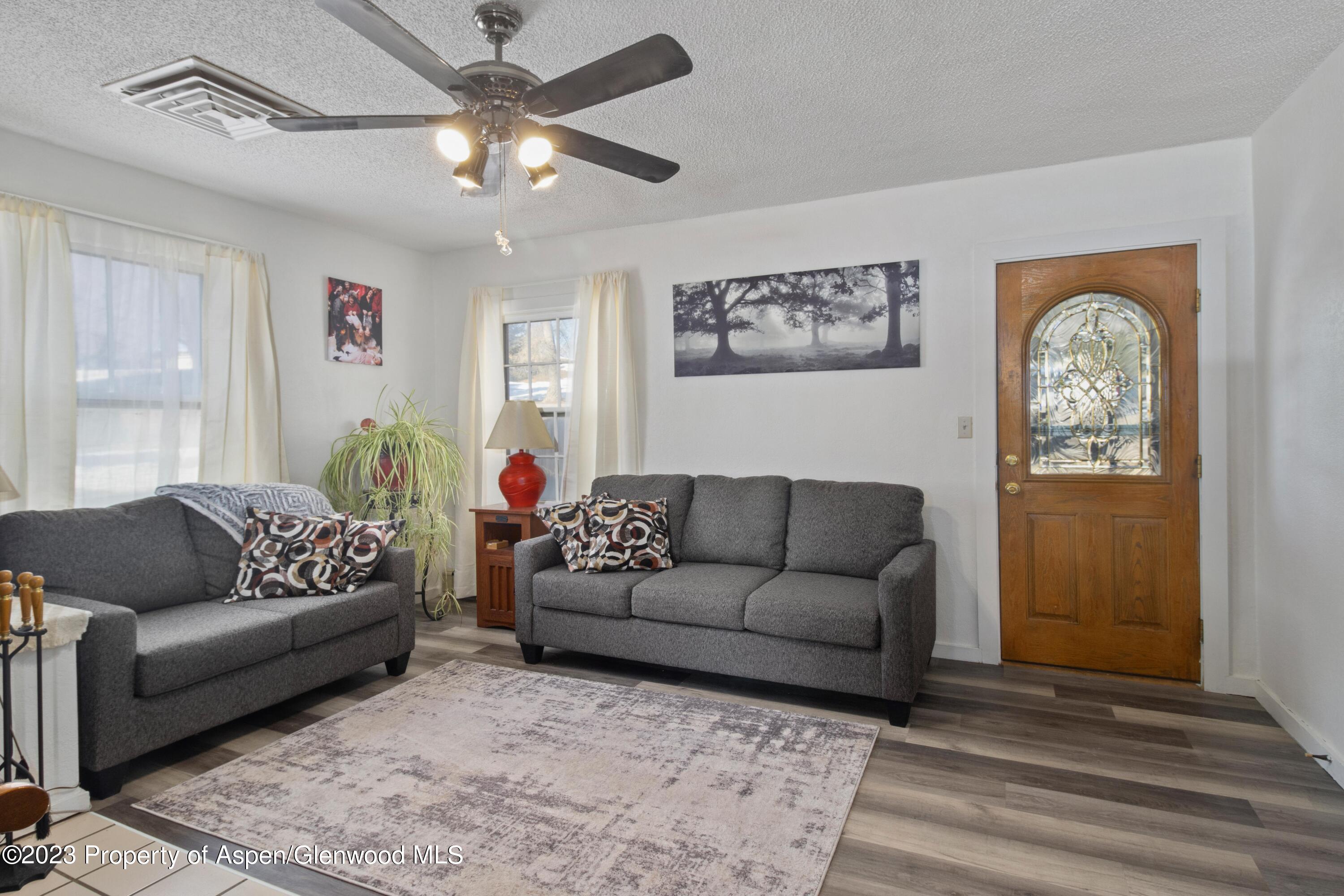 915 East 7th Street Rifle, CO 81650 - Photo 10 of 22 a living room with furniture and a window