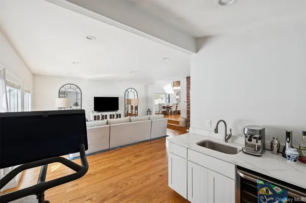a kitchen with a sink cabinets and window
