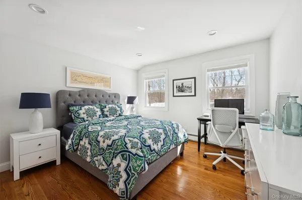 a bedroom with a bed and a couch