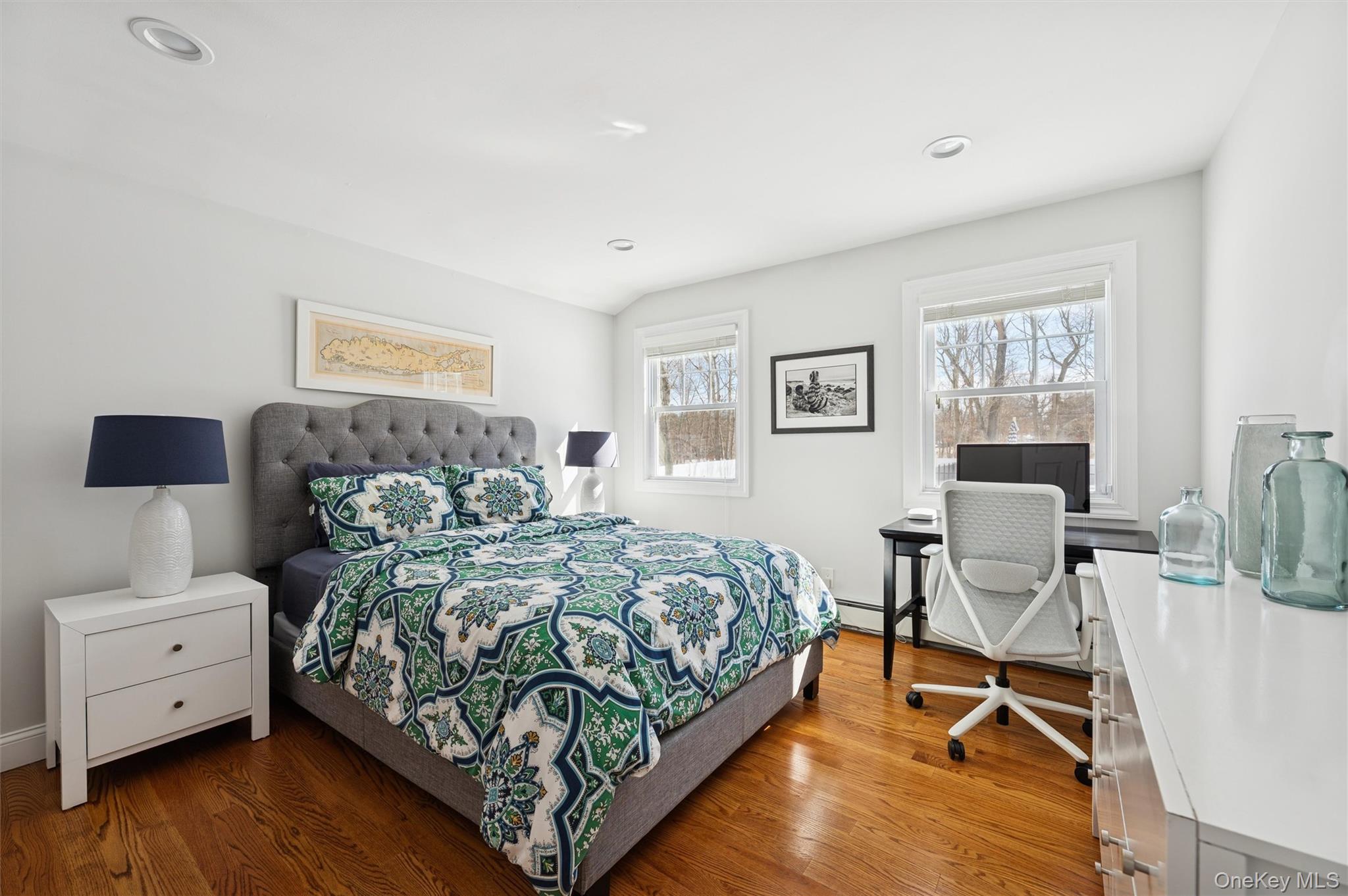 4 Stuart Court Hampton Bays, NY 11946 - Photo 13 of 20 a bedroom with a bed and a couch