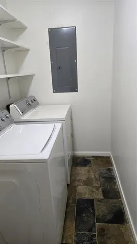 a view of backyard with swimming pool and seating space