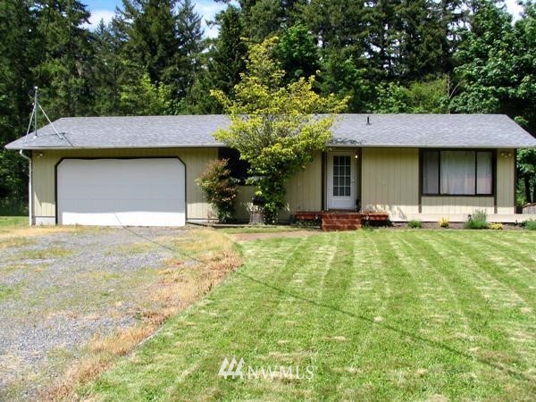 14342 Vail Cut Off Road Southeast Rainier, WA 98576 - Photo 1 of 1 a front view of a house with a yard