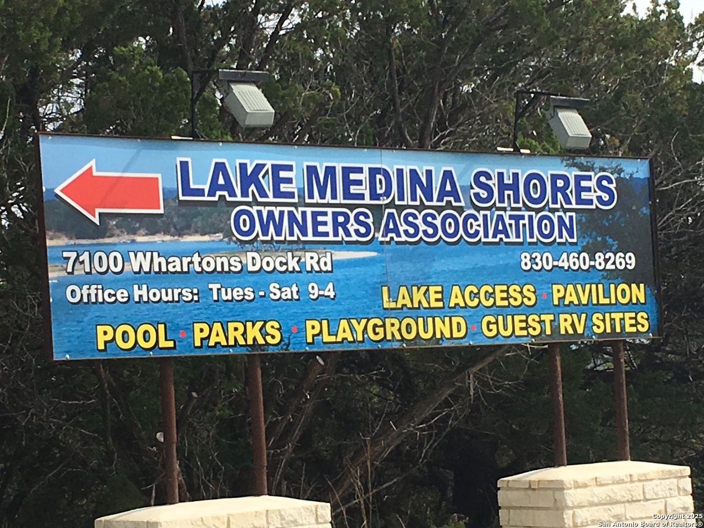 157 Hillside Road Bandera, TX 78003 - Photo 22 of 27 a sign that is sitting on a wooden wall