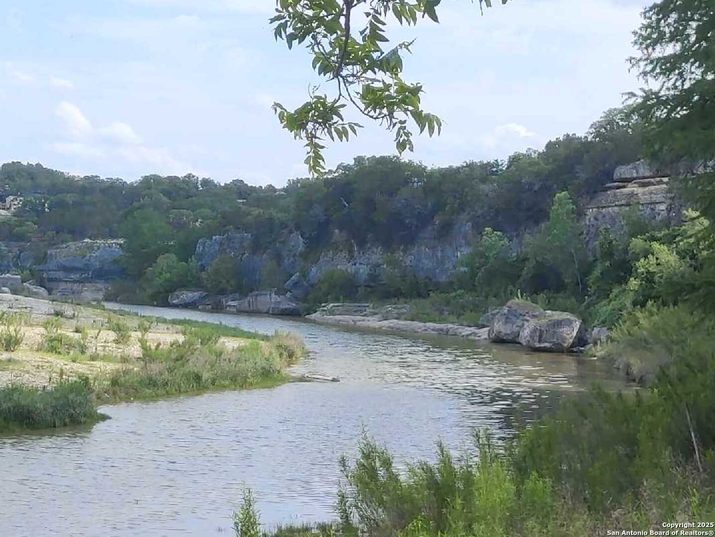 157 Hillside Road Bandera, TX 78003 - Photo 25 of 27 a view of a small pool with a yard