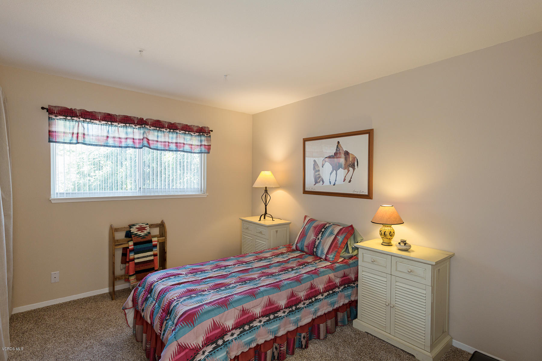 2459 Fitzgerald Road Simi Valley, CA 93065 - Photo 22 of 28 a bedroom with a bed and a lamp on dresser