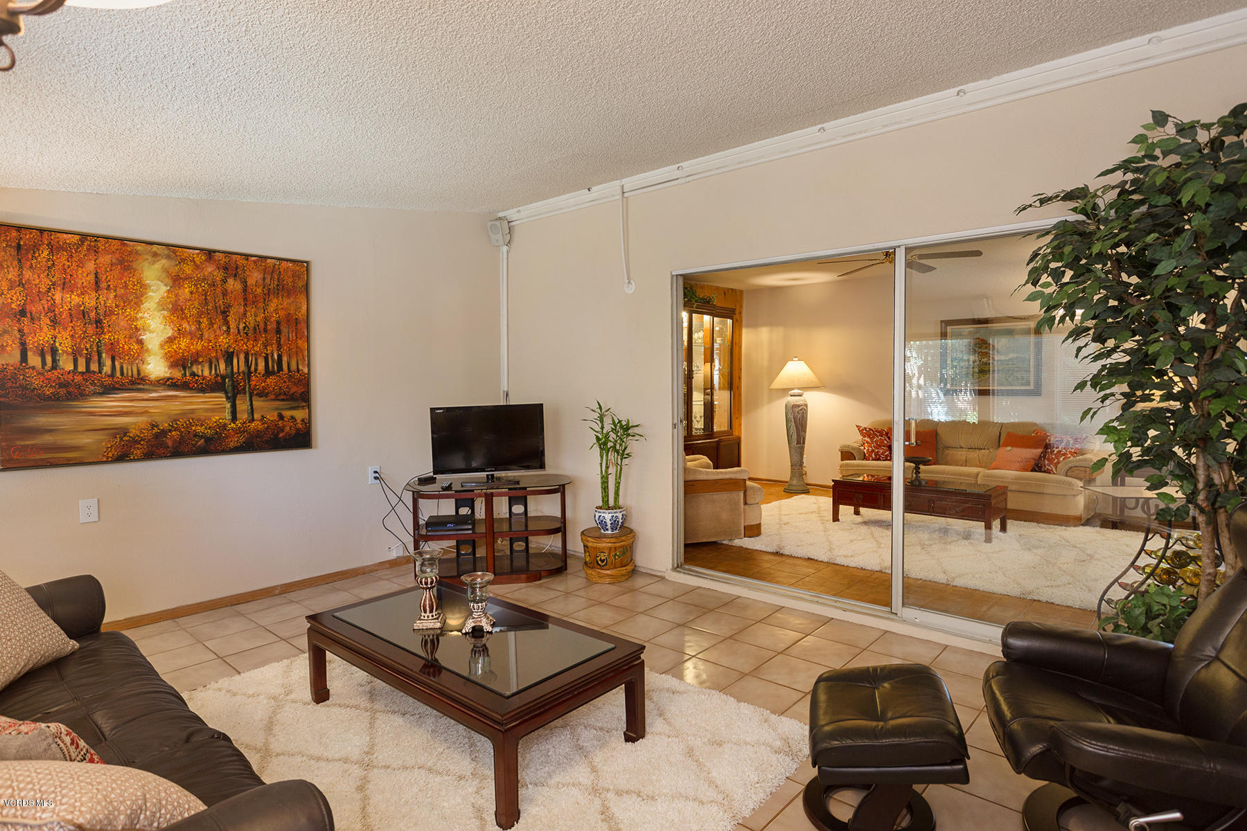2459 Fitzgerald Road Simi Valley, CA 93065 - Photo 8 of 28 a living room with furniture and a flat screen tv