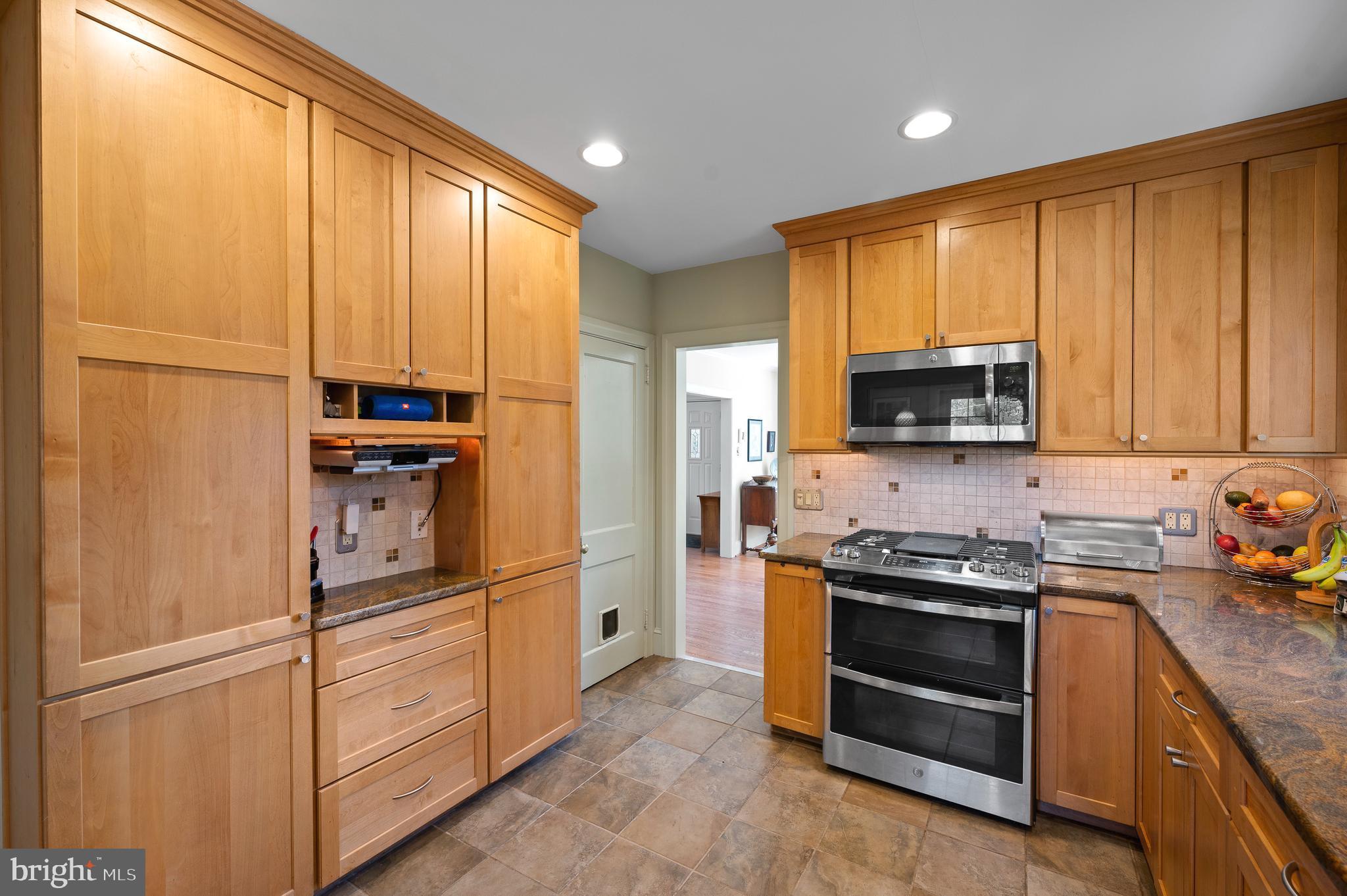 7 West Amherst Road Bala Cynwyd, PA 19004 - Photo 13 of 40 a kitchen with stainless steel appliances granite countertop a refrigerator stove and sink