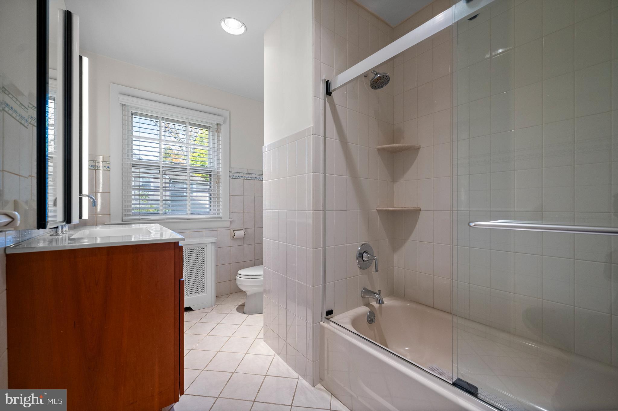 7 West Amherst Road Bala Cynwyd, PA 19004 - Photo 20 of 40 a bathroom with a granite countertop bathtub shower sink vanity and toilet