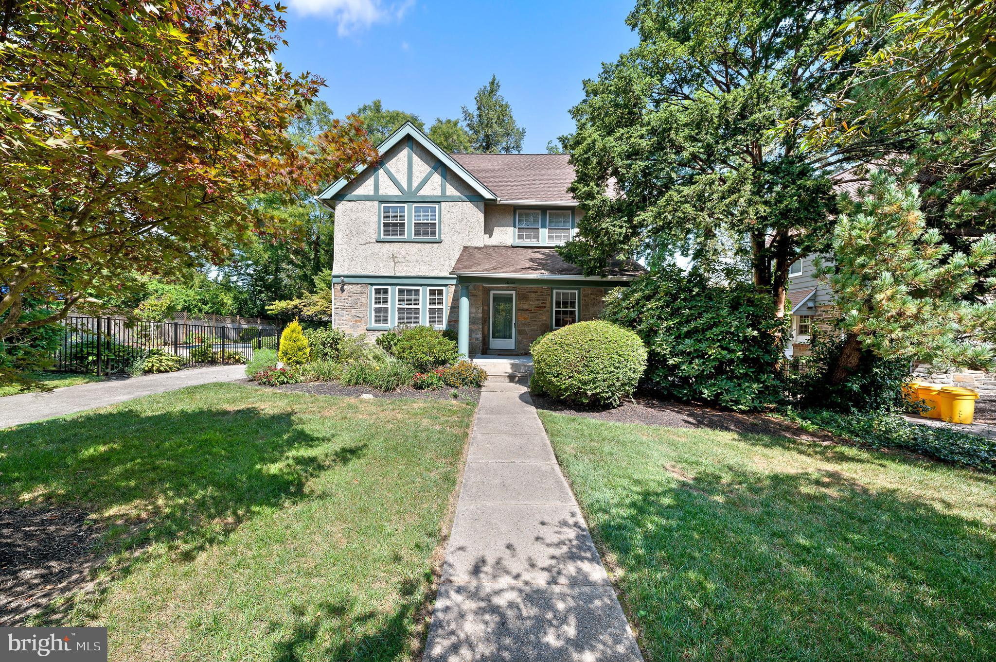 7 West Amherst Road Bala Cynwyd, PA 19004 - Photo 2 of 40 a front view of a house with a yard and garage