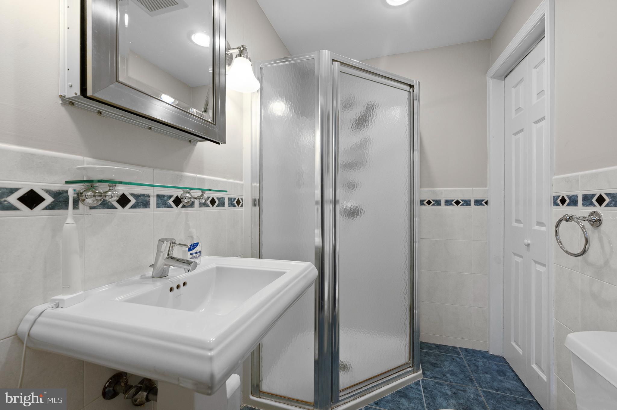 7 West Amherst Road Bala Cynwyd, PA 19004 - Photo 25 of 40 a bathroom with a sink a toilet and shower