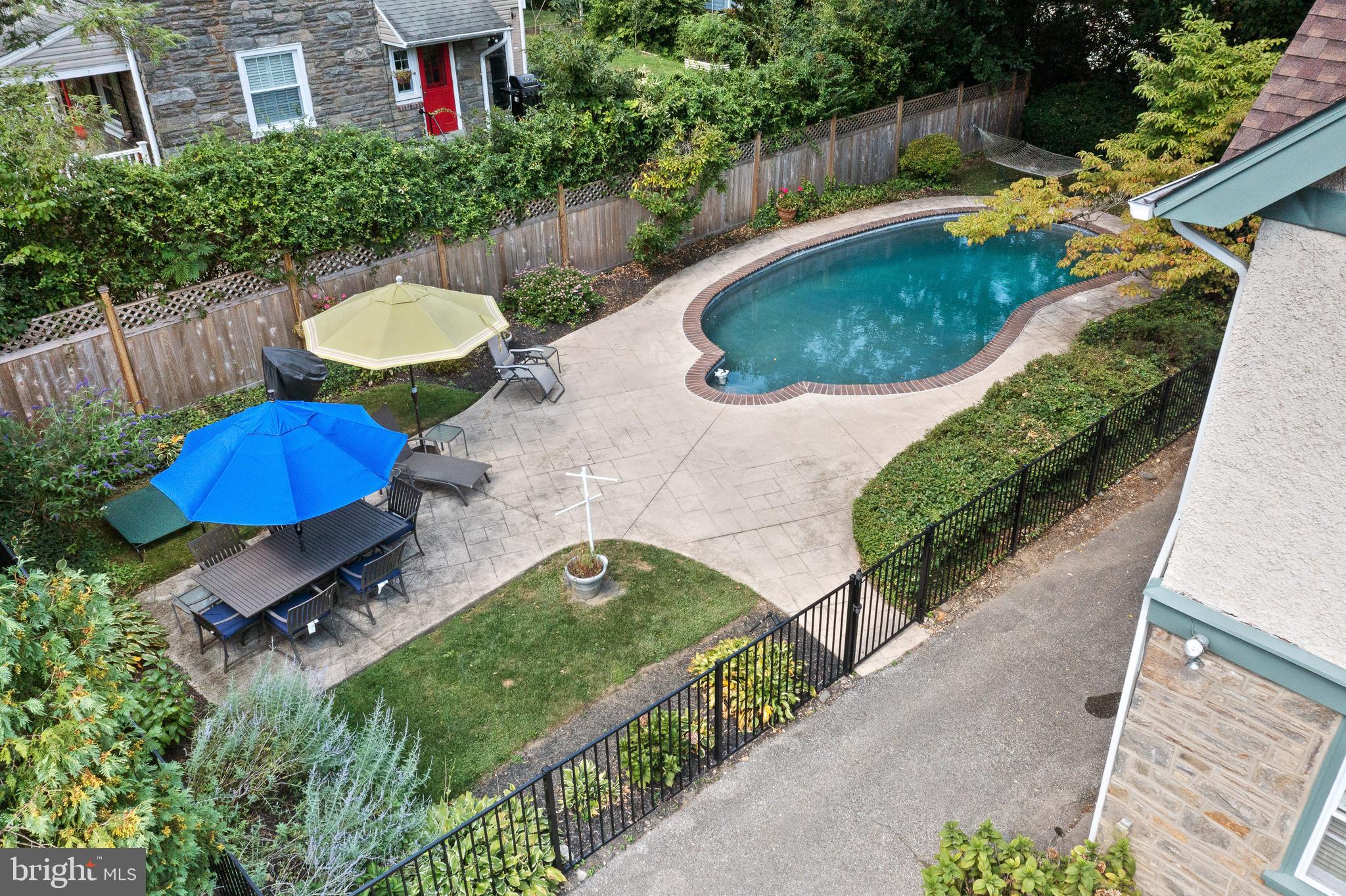 7 West Amherst Road Bala Cynwyd, PA 19004 - Photo 34 of 40 a swimming pool with outdoor seating and garden