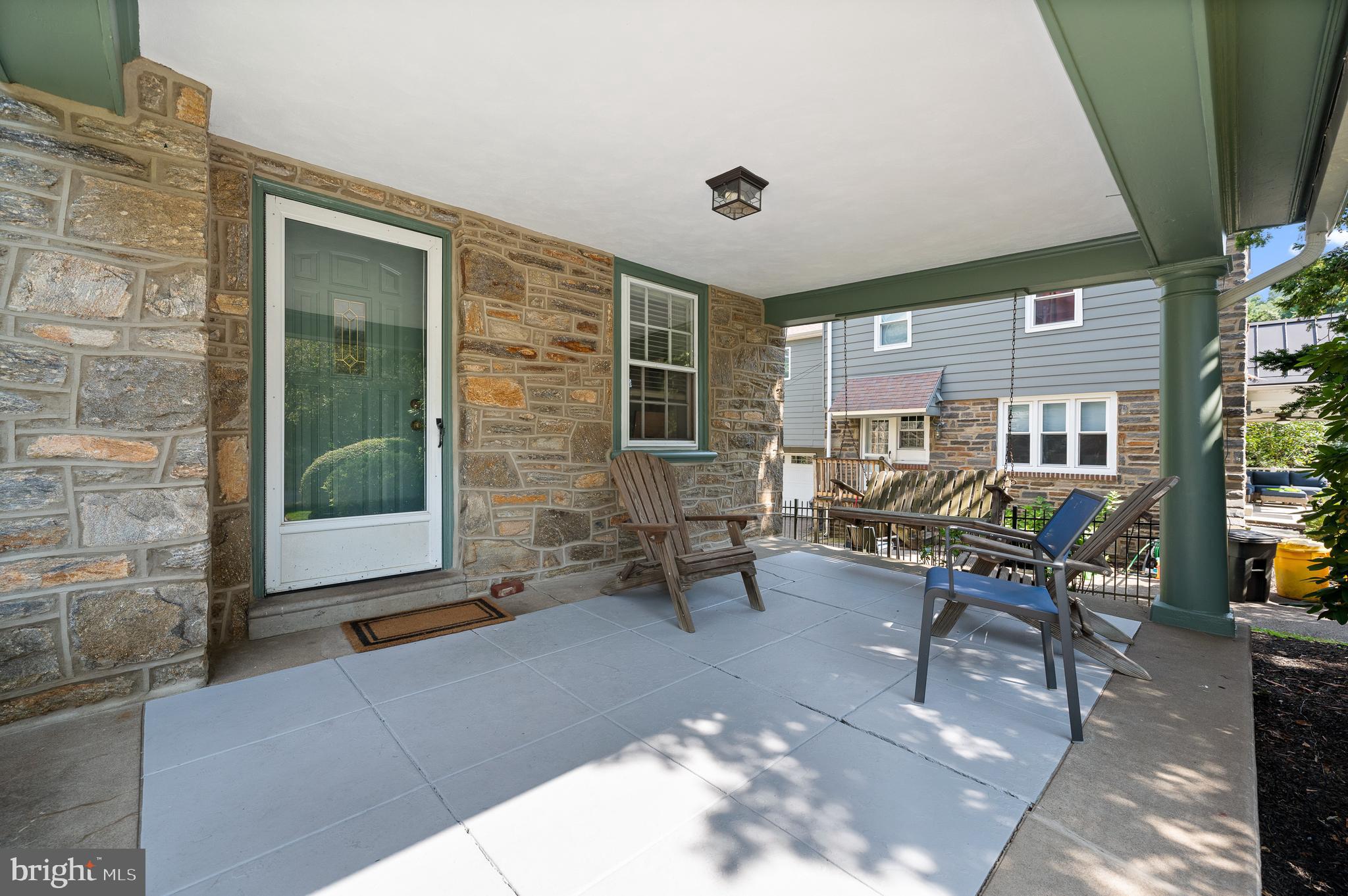 7 West Amherst Road Bala Cynwyd, PA 19004 - Photo 5 of 40 a living room filled with furniture and a potted plant