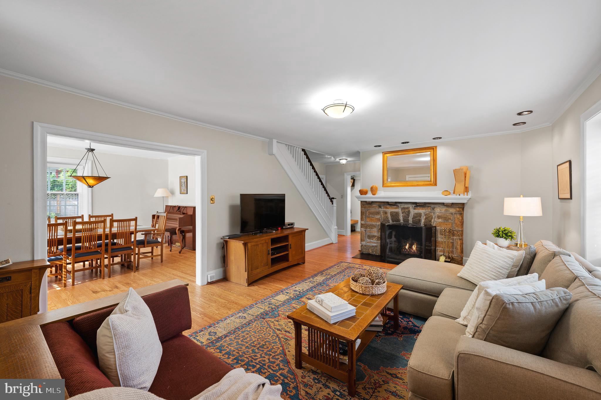 7 West Amherst Road Bala Cynwyd, PA 19004 - Photo 8 of 40 a living room with furniture a fireplace and a flat screen tv