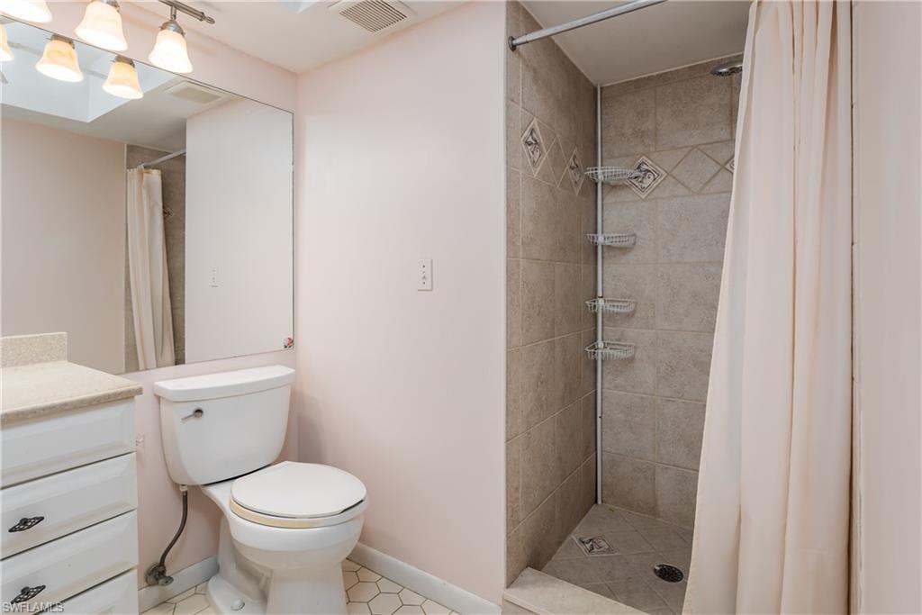 28 Watercolor Way, Unit 28 Naples, FL 34113 - Photo 12 of 29 a bathroom with a toilet and a shower