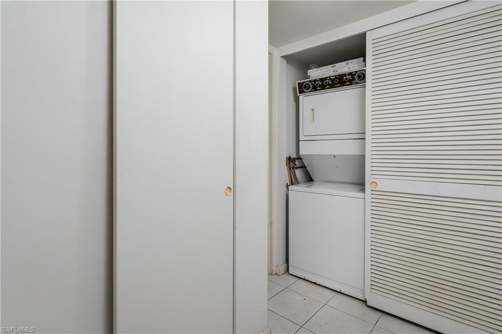 28 Watercolor Way, Unit 28 Naples, FL 34113 - Photo 17 of 29 a utility room with dryer and washer
