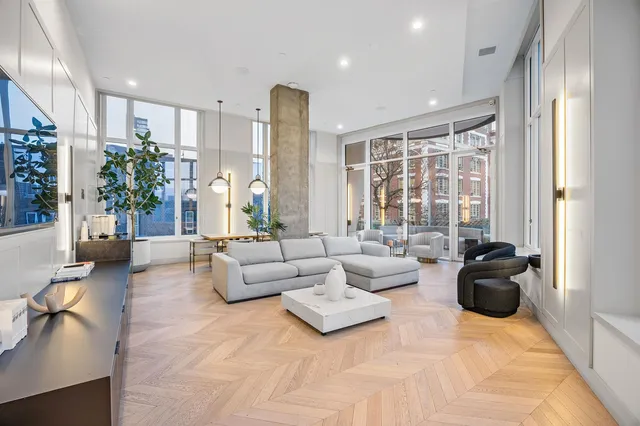 a view of a room with furniture and window