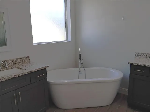 a white bath tub sitting in a bathroom
