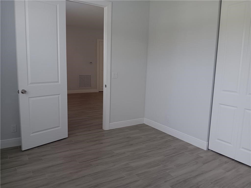 2121 Bridgehampton Terrace Vero Beach, FL 32966 - Photo 24 of 33 a view of a room with wooden floor