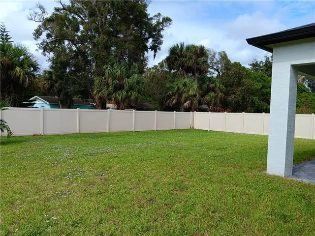 a view of backyard with green space