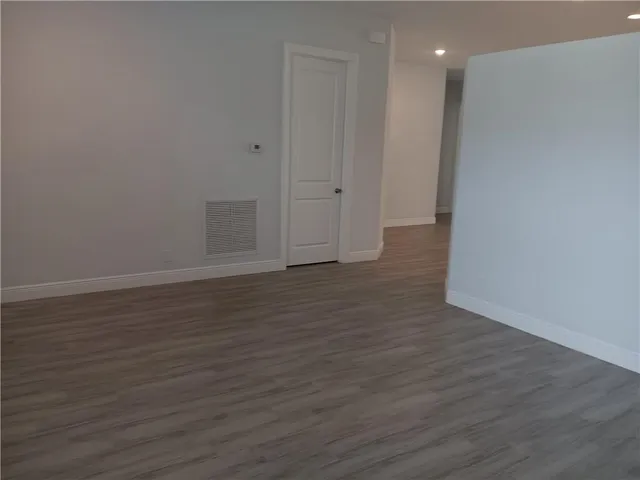 a view of a livingroom with wooden floor