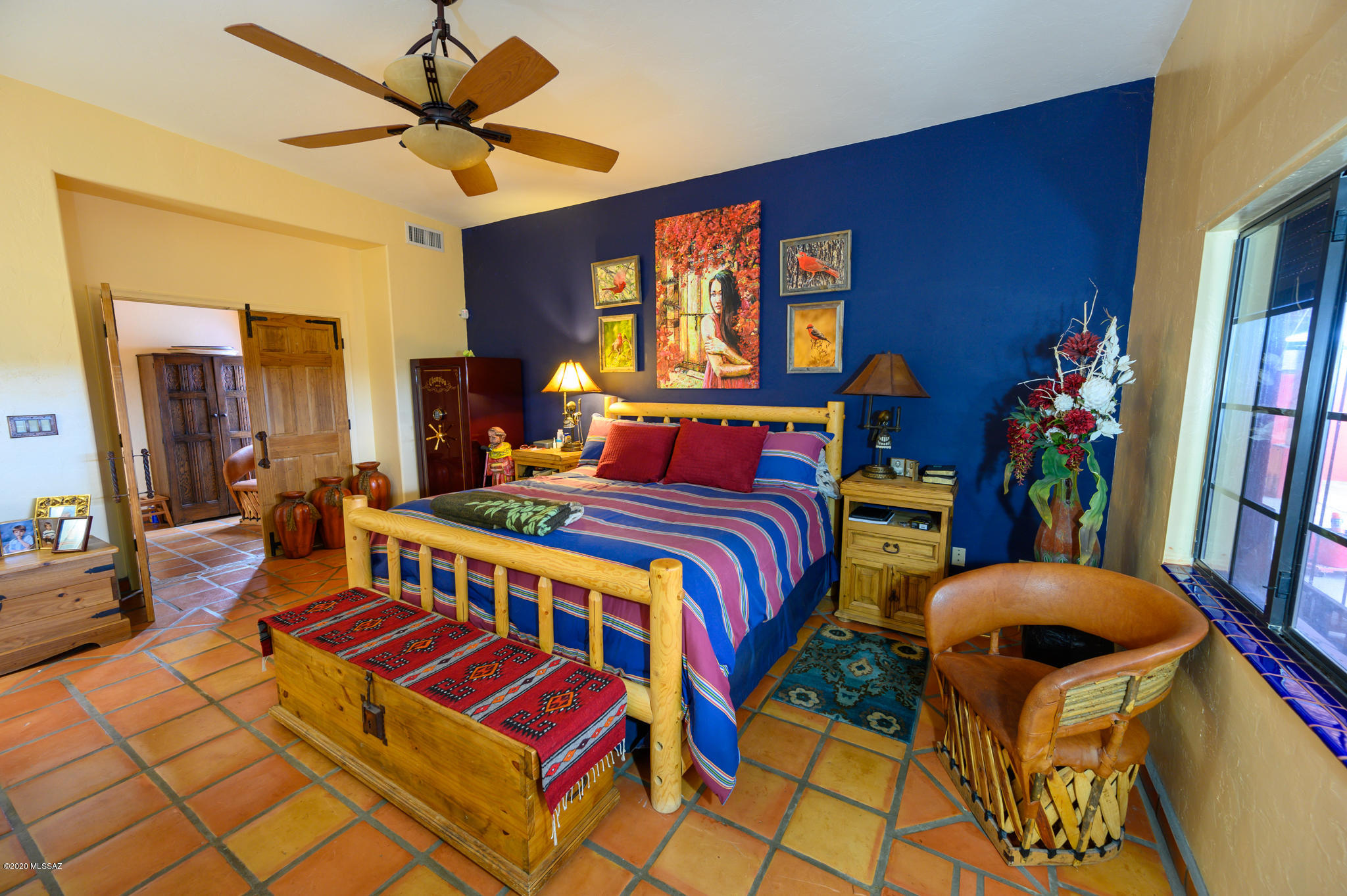 893 Gecko Lane Rio Rico, AZ 85648 - Photo 27 of 40 a bedroom with furniture and a window