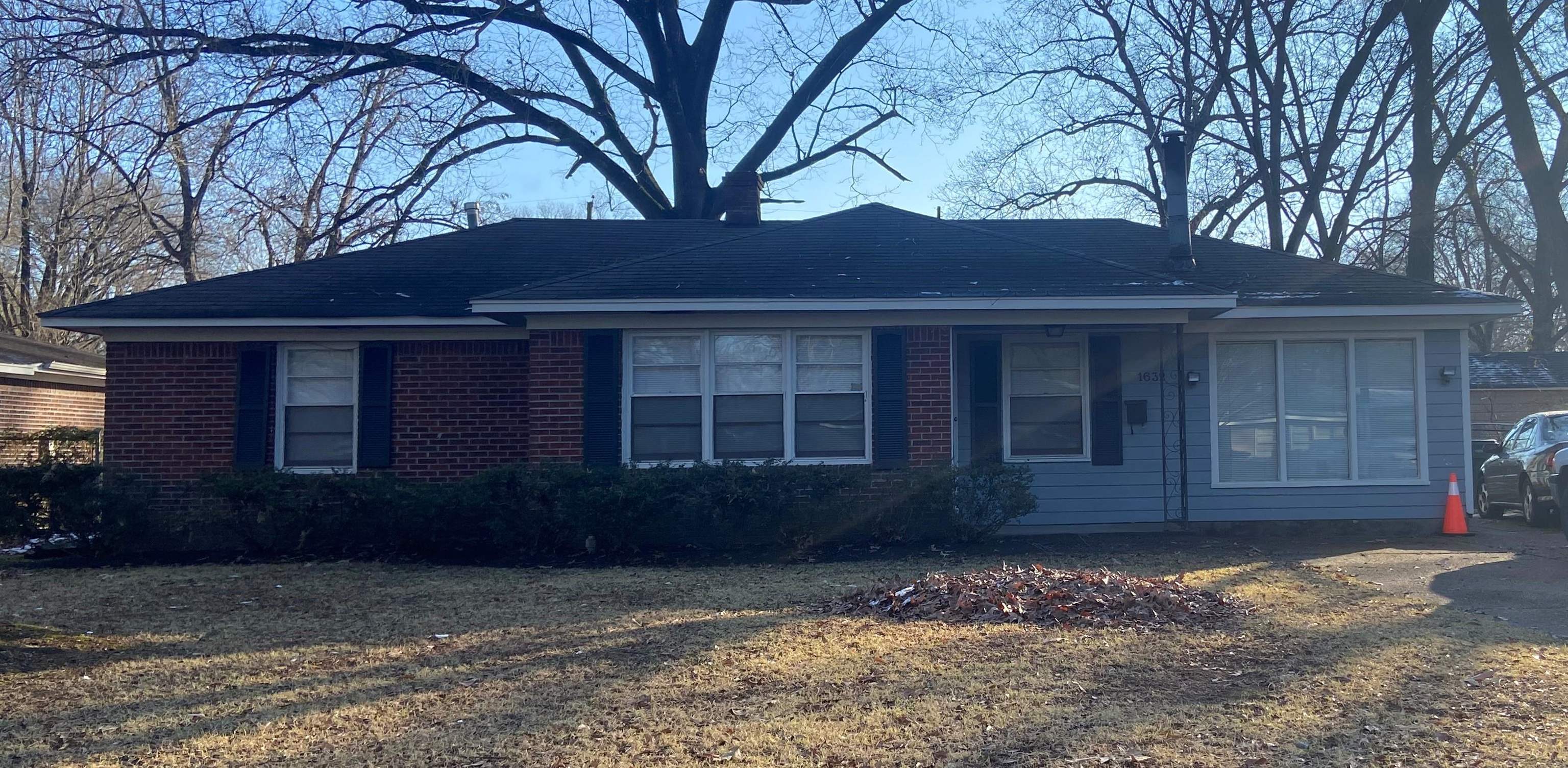 1632 Marcia Road Memphis, TN 38117 - Photo 1 of 13 a house with trees in front of it