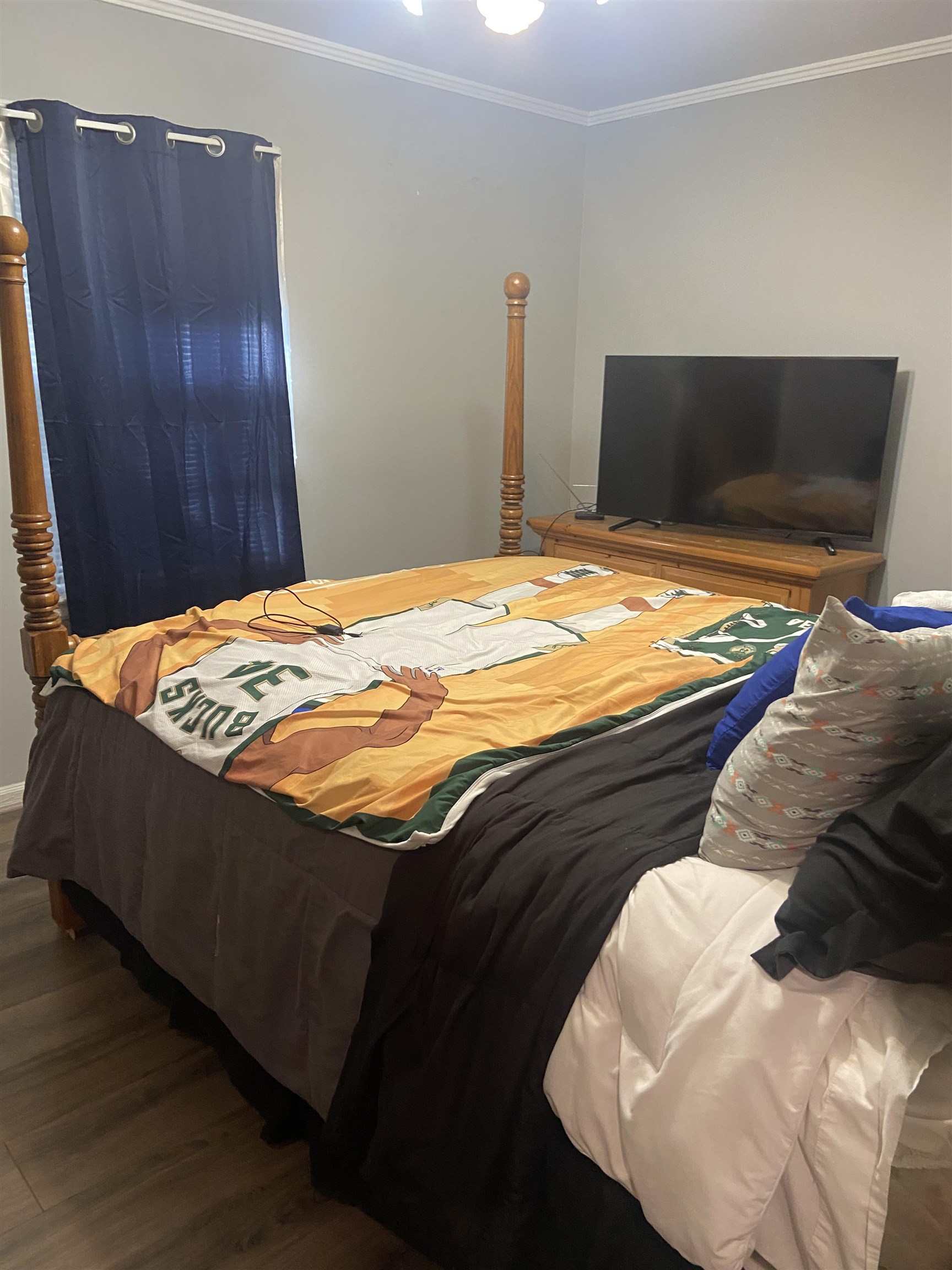 1632 Marcia Road Memphis, TN 38117 - Photo 9 of 13 a bedroom with a bed and wooden floor