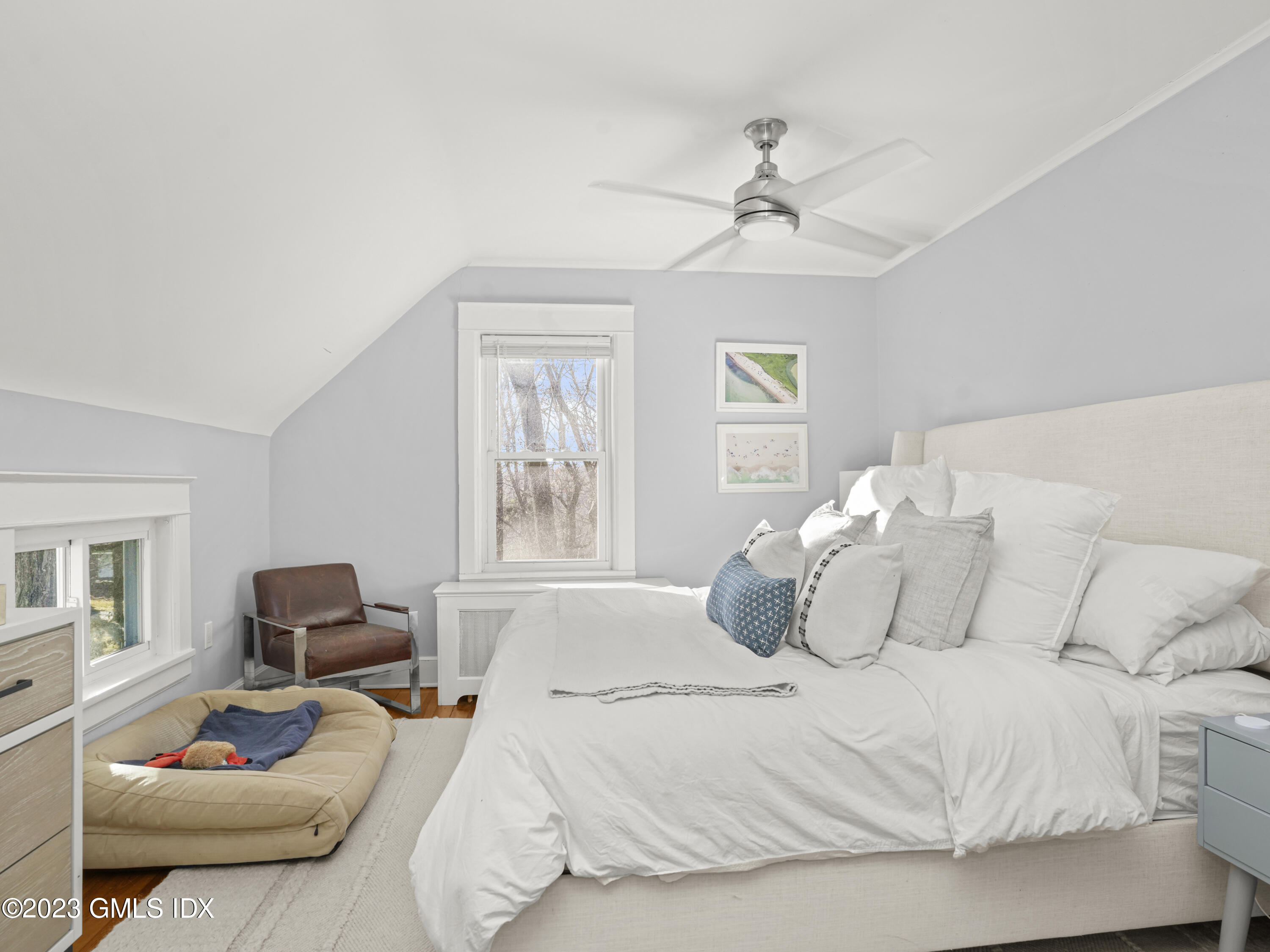 15 Locust Road, Unit COTTAGE Greenwich, CT 06831 - Photo 14 of 25 a bedroom with a bed and window