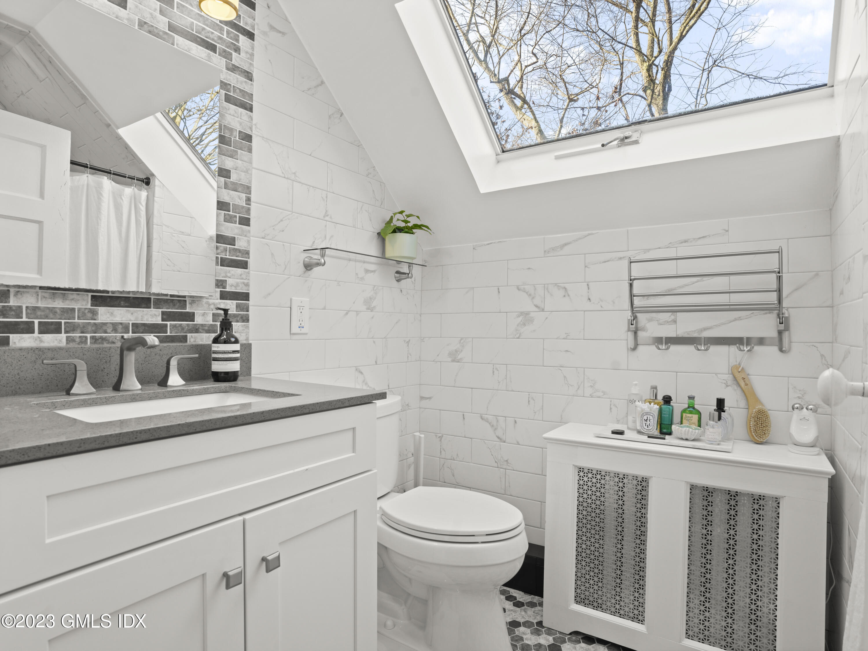 15 Locust Road, Unit COTTAGE Greenwich, CT 06831 - Photo 17 of 25 a bathroom with a sink a toilet and vanity